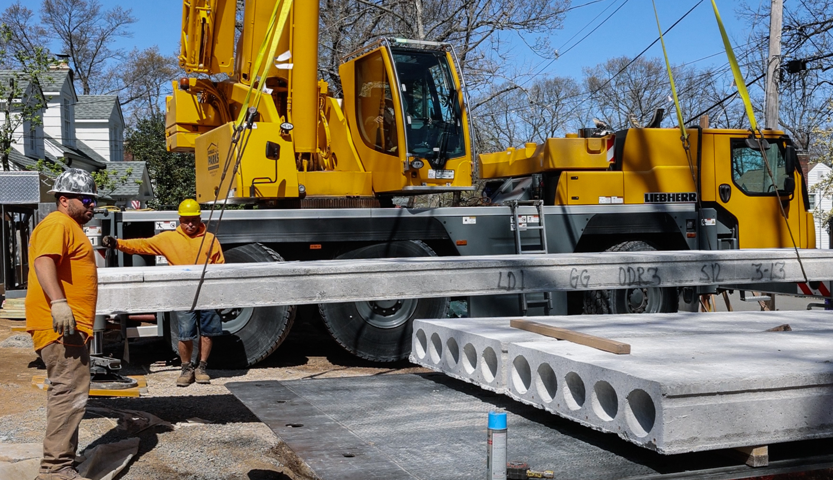 Liebherr crane lifting precast on residential job