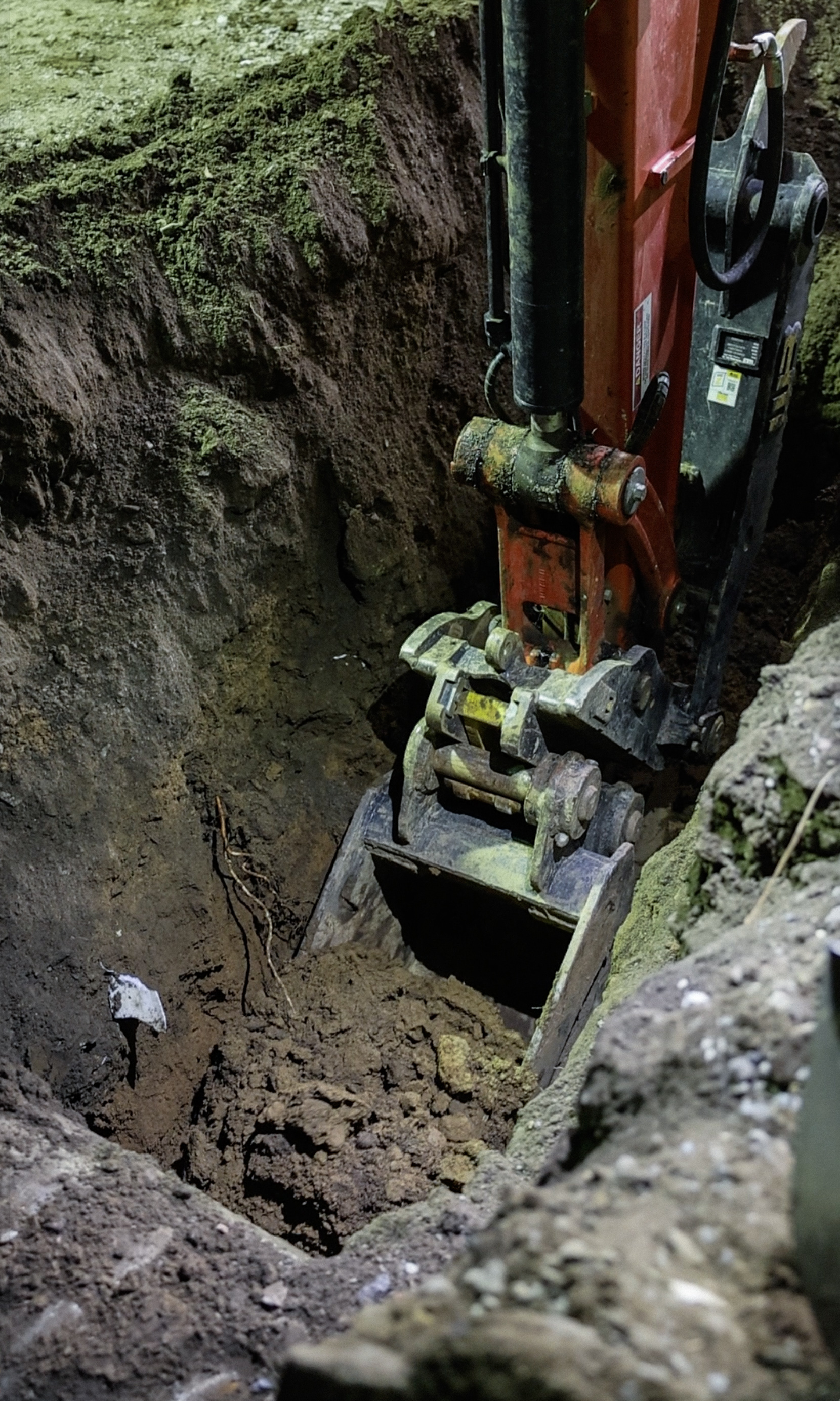 Excavator bucket in deep trench