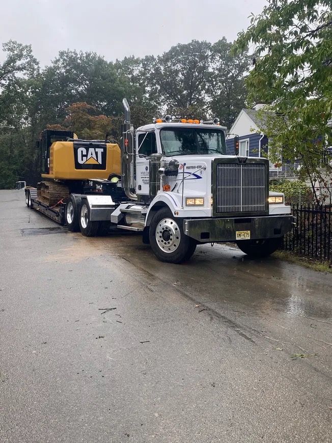 CAT excavator on flatbed transport