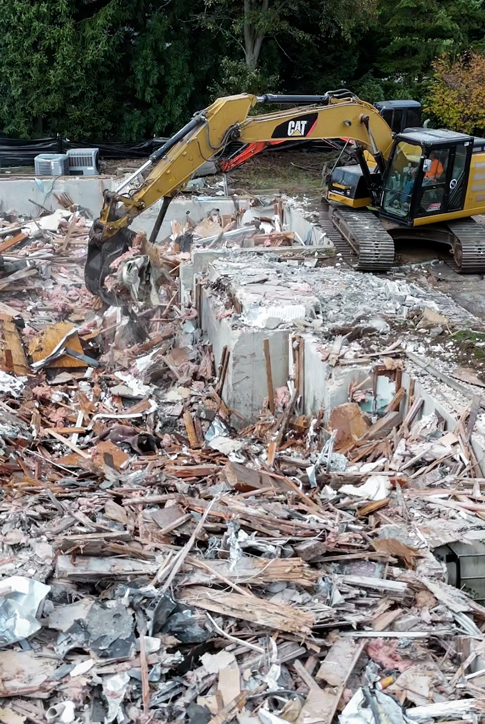 CAT excavator demolition project