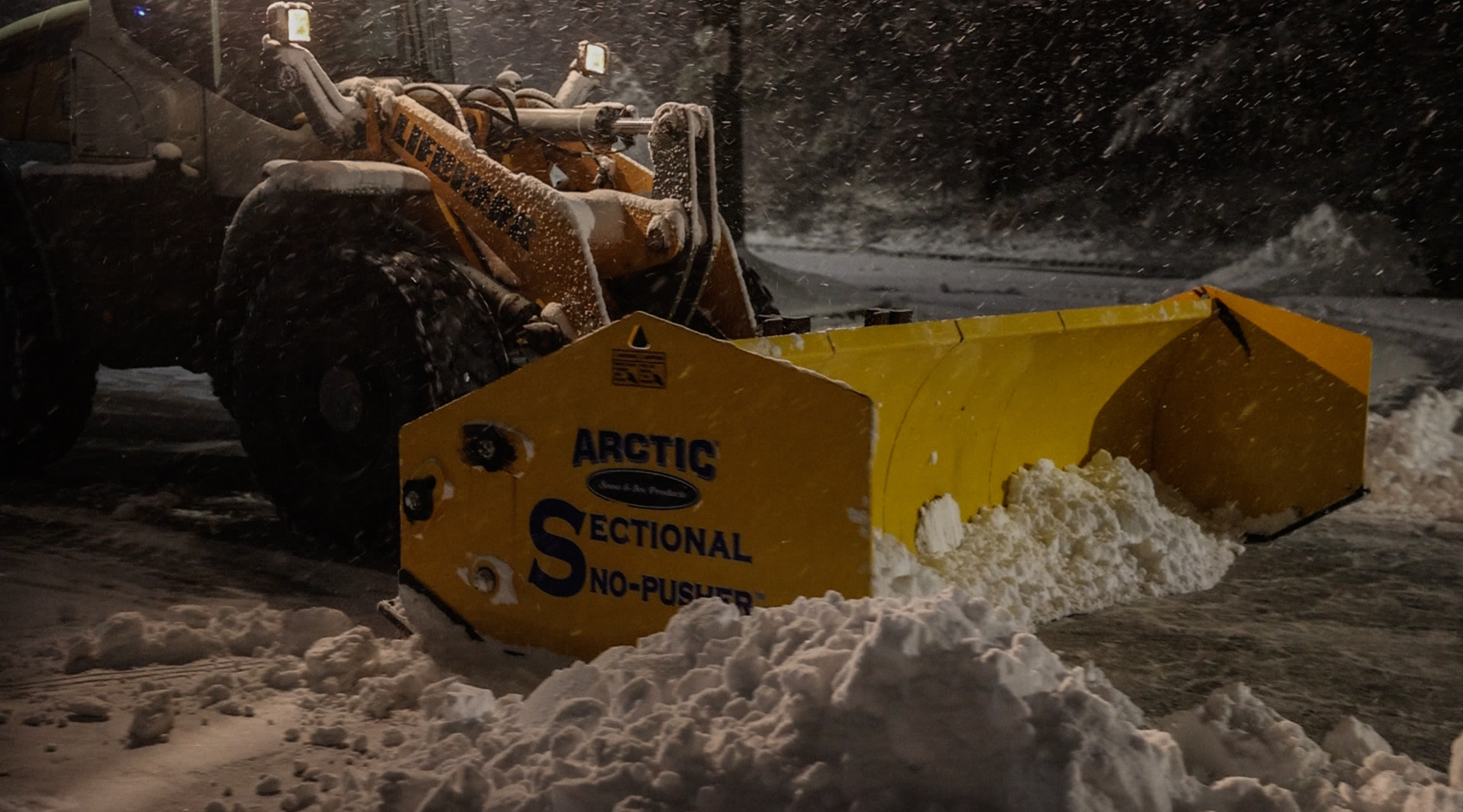 Arctic snow pusher in heavy snowfall